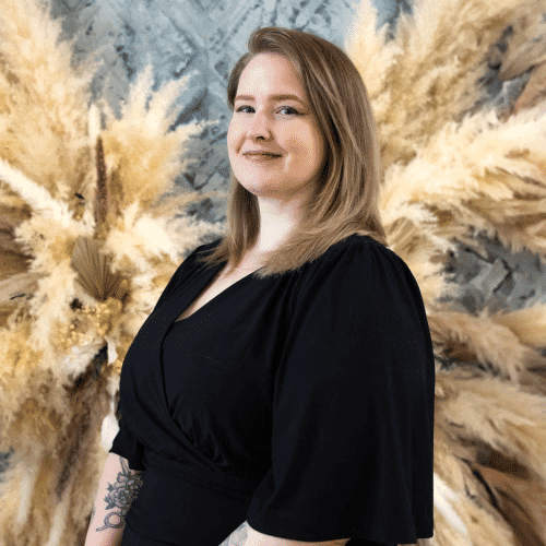 Portrait of Deanna Brown, a professional stylist at Salon Felice Uptown, showcasing their expertise and style.